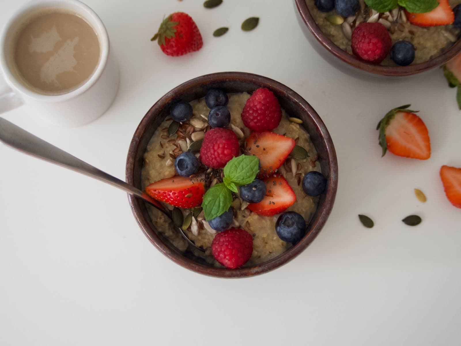 A bowl of oatmeal topped with fresh berries